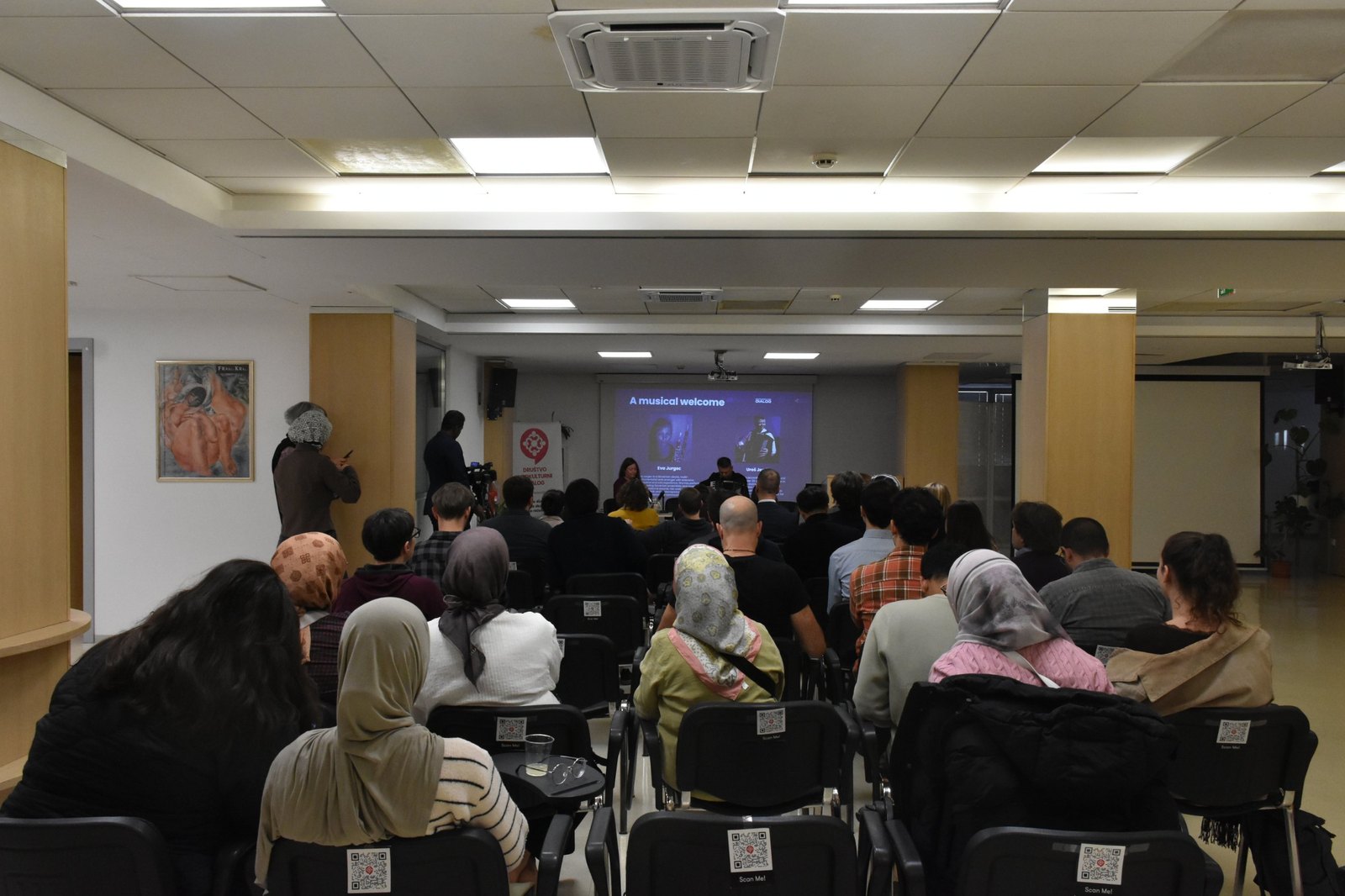 View from the back rows of the full hall during the musical welcome