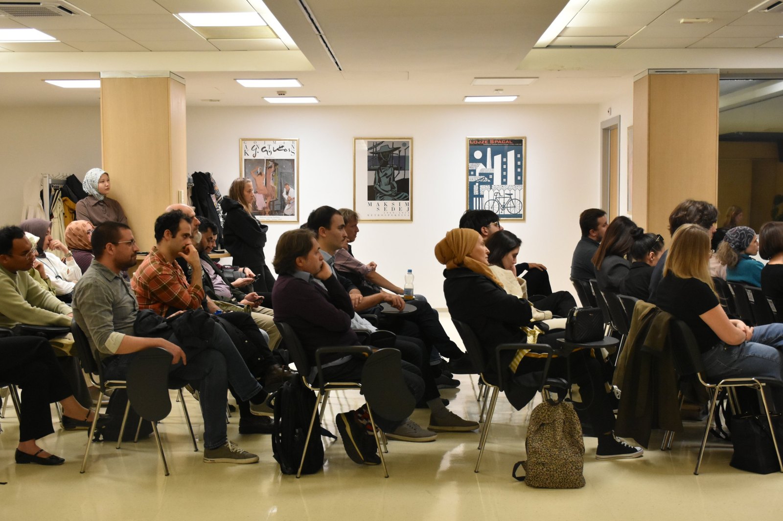 Audience members following the discussion